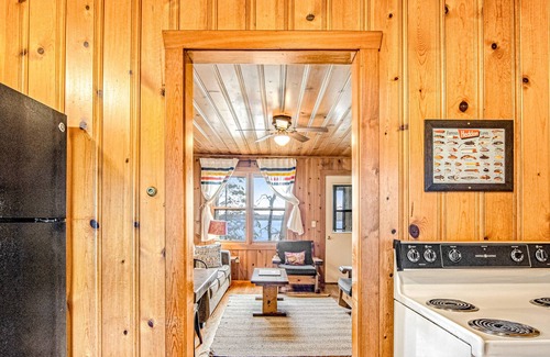 Presque Isle Cabin | Dog-friendly cabin with waterfront views, lake access, sandy beach, & rec room