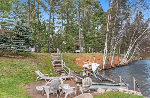 Presque Isle Cabin | Dog-friendly cabin with lakefront views, swimming, fishing, firepit, & rec room