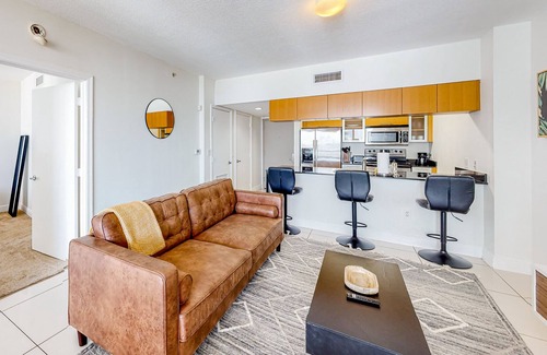 Edgewater Apartment | Dog-friendly condo with balcony, pool, & partial ocean view - walk to beach