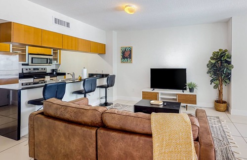 Edgewater Apartment | Dog-friendly condo with balcony, pool, & partial ocean view - walk to beach