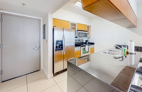 Edgewater Apartment | Dog-friendly condo with balcony, pool, & partial ocean view - walk to beach