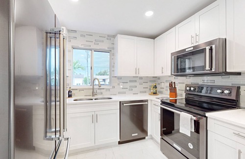 Isles of Capri House | Dog-friendly duplex with a patio, deck, washers, dryers, & central AC