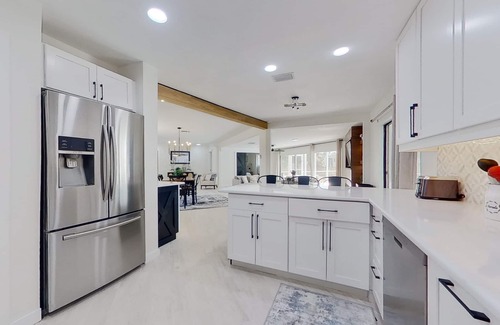 Fort Myers House | Dog-friendly home with private pool, dock, fireplace, patio, grill, & canal view