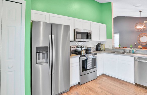 Wellington House | Dog-friendly home with pool, game room, AC, & washer/dryer