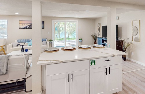 Shoreline House | Dog-friendly lake view home with kitchen & kitchenette, patio, sunroom