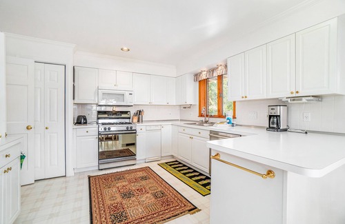 Arcadia House | Dog-friendly, lake view home with three season room, fireplace, video projector