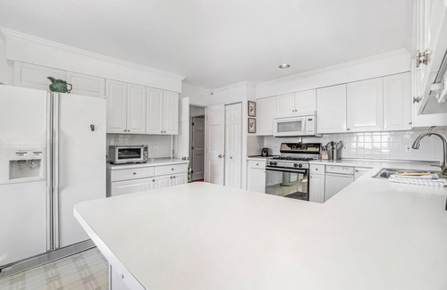 Arcadia House | Dog-friendly, lake view home with three season room, fireplace, video projector