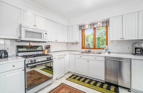 Arcadia House | Dog-friendly, lake view home with three season room, fireplace, video projector