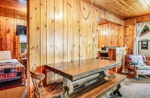 Presque Isle Cabin | Dog-friendly lakefront cabin with swimming, fishing, boating, & rec room