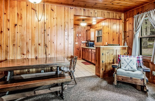 Presque Isle Cabin | Dog-friendly lakefront cabin with swimming, fishing, boating, & rec room