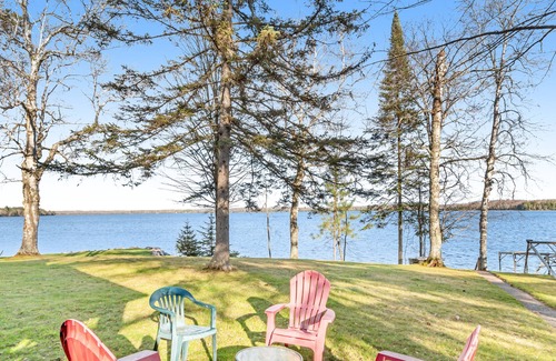 Presque Isle House | Dog-friendly lakefront home with fireplace, porch, water access, & rec room