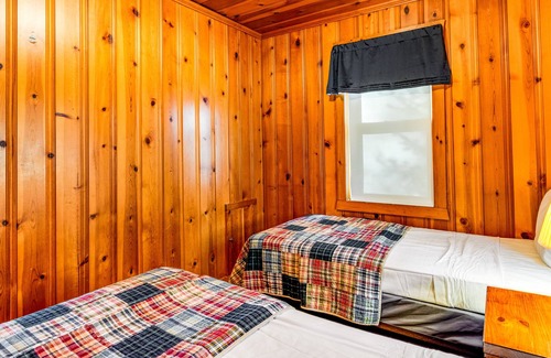Presque Isle Cabin | Dog-friendly lakefront cabin with on-site swimming, fishing, & rec room