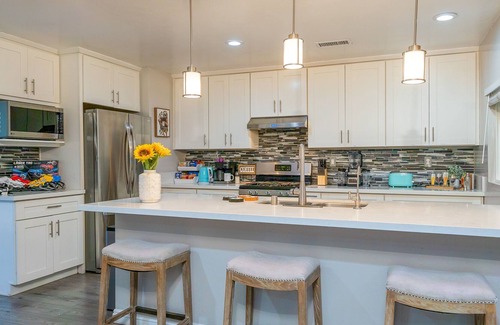 Orange House | Dog-friendly retreat near Disney with enclosed yard, cornhole, central AC, & W/D
