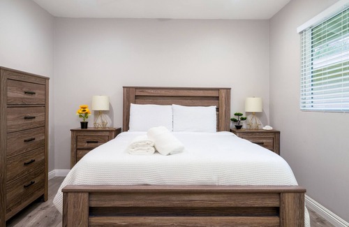 Orange House | Dog-friendly retreat near Disney with enclosed yard, cornhole, central AC, & W/D