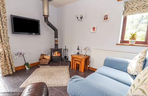 Dolphin Cottage | DOLPHIN BACH, pet friendly, with open fire in Dolphin