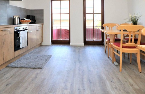 Ostseebad Wustrow Apartment | Double room with balcony and Bodden view directly at the harbor of Wustrow