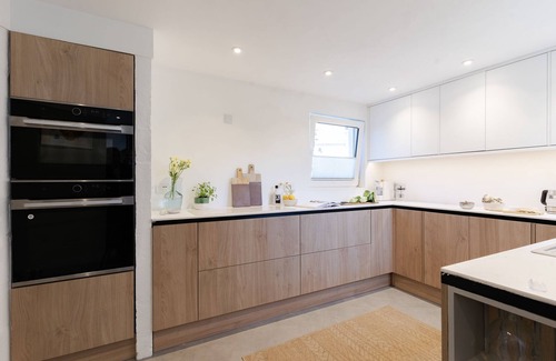 Downderry House | Downderlin is a light-filled beautiful home with a large garden that rolls directly onto the beach.