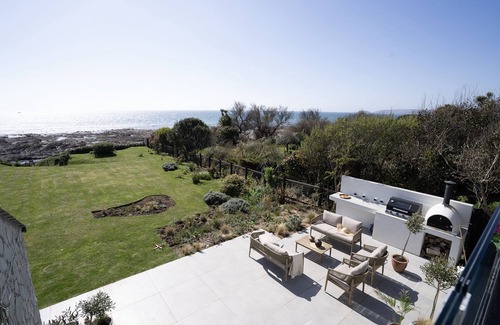 Downderry House | Downderlin is a light-filled beautiful home with a large garden that rolls directly onto the beach.