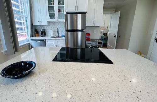 Boise Apartment | Downtown Digs-View of the City! Stay above local restaurants and nightlife, posh amenities heated toilet seat, oversized rain shower head in glass shower, in-unit laundry, one garage parking spot