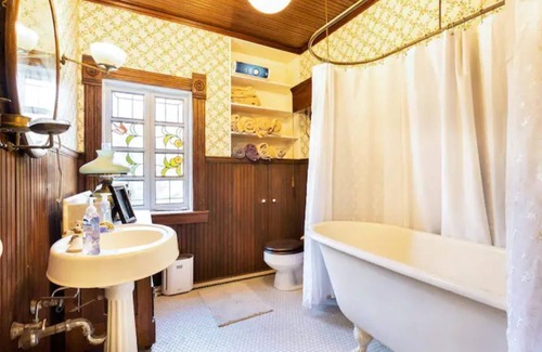 Liberty House | Downtown Liberty Historic Home with Screened Porch