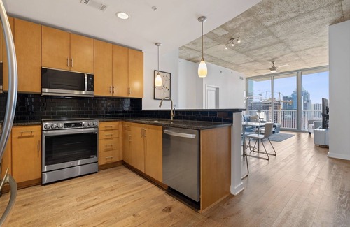Second Street District Condo | Downtown Luxury Hi-rise 2 BR/2Bth, 2 garage spaces, gym, heated pool, 55&70"HDTV