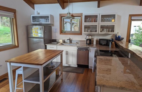 Freeland House | Downtown retreat with hot tub, & beach steps away
