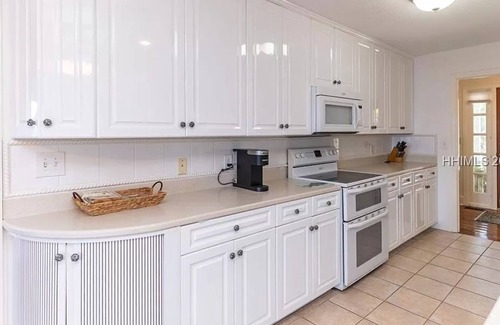 Saint Helena Island House | Dreamworthy, waterfront St. Helena home with pool and deep water dock.