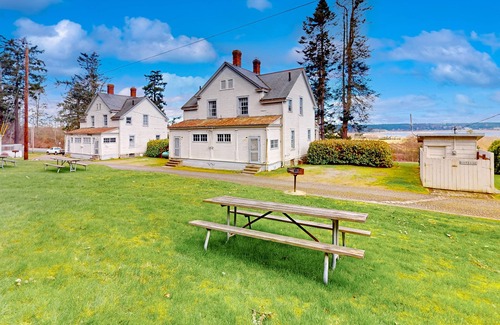 Coupeville House | Duplex cottage next to Fort Casey State Park with porch & Puget Sound view