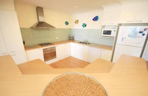 Smiths Lake House | Eleebana~Wood fire~Kayaks~Kids retreat with soccer table~inhouse movies NBN