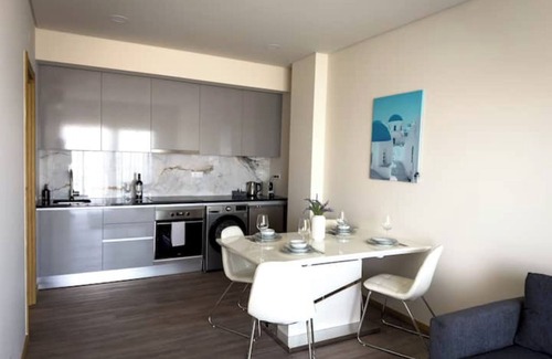 Patio Condo | Elegant apartment overlooking the sea with infinity pool, beach 5 minutes away.