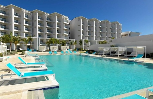 Punta Cana Apartment | Elegant Art Suite: Freestanding Tub, Rainforest Showers, and Premium Benefits