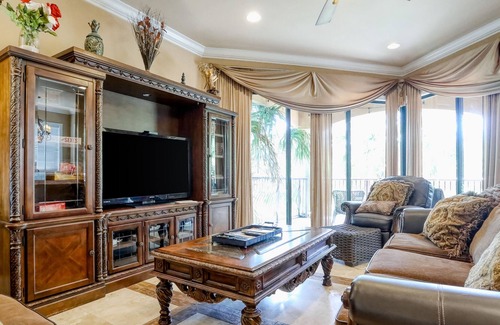 St. Tropez House | Elegant coastal villa with spacious patio, pool, hot tub, free WiFi & central AC