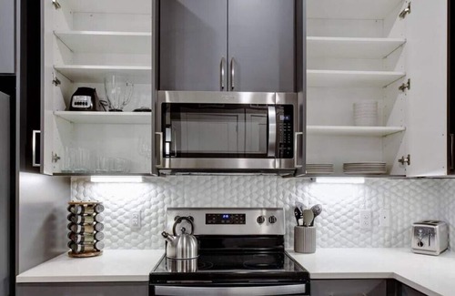 Main - Military Plaza Apartment | Elegant Escape | Fast WiFi | Pool | Free Parking