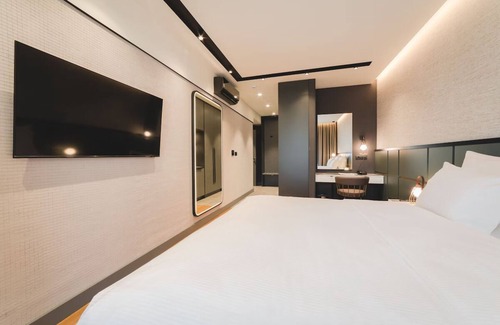 Podgorica Hotel | Elegant Haven w/City Views – Breakfast, Parking, Private Balcony