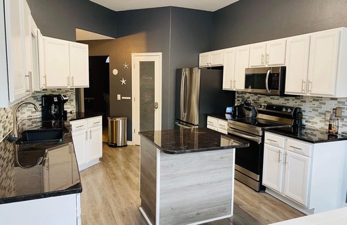 Navarre House | Elegant single level with 4 BR 3 BA, private oasis featuring a heated salt pool