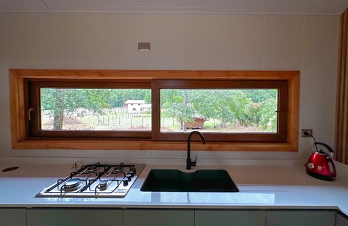 Pucon Cottage | Enarbol Lodge, private hot tube on terrace. High-rise house among trees