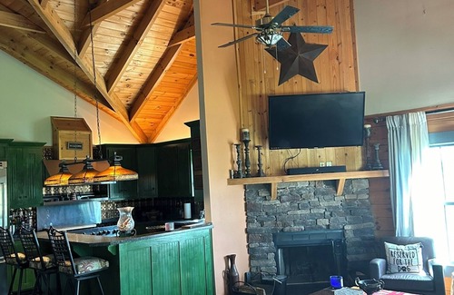 Ray County House | Enchanting cabin offers the perfect blend of rustic charm & modern luxury.