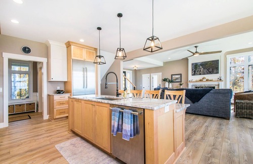 Riverside House | Enchanting lakefront home with pool, hot tub, firepit, game room, & washer/dryer