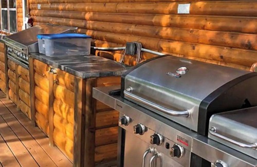 Rice Lake Ski Chalet | Enjoy a quiet stay on your own private deck by the lake in Room 21: Ponderosa-a Western Themed Chalet