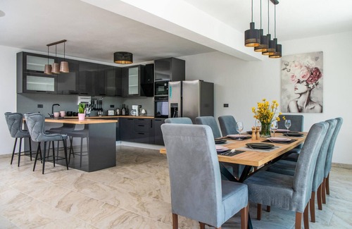 Kozljani House | Enjoy a relaxing time in this modern vacation home with pool.