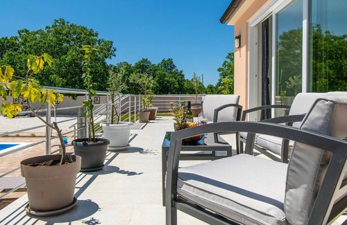 Kozljani House | Enjoy a relaxing time in this modern vacation home with pool.