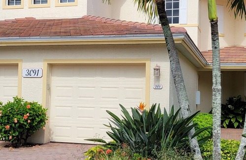 Fort Myers Condo | Enjoy spectacular sunsets in this upper coach house with a West Indies flair.