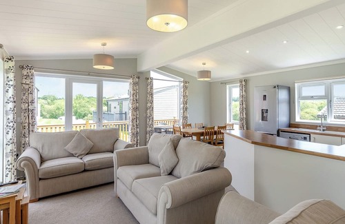 Hewas Water Ski Chalet | Escape to the Jasmine Lodge, nestled amidst stunning rolling countryside.