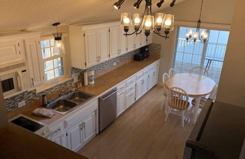 Sunrise Beach House | Estate nestled in woods on Lake of the Ozarks