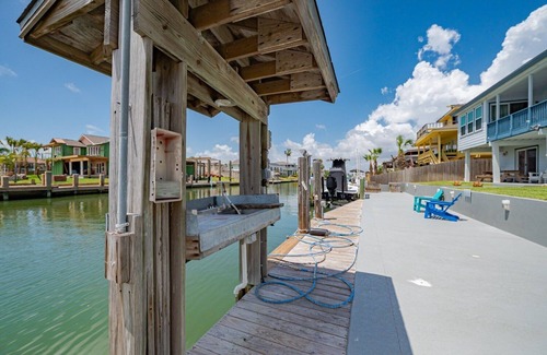 City-by-the Sea House | Estes Oasis! Canal front home with private lighted dock! Views! Foosball game