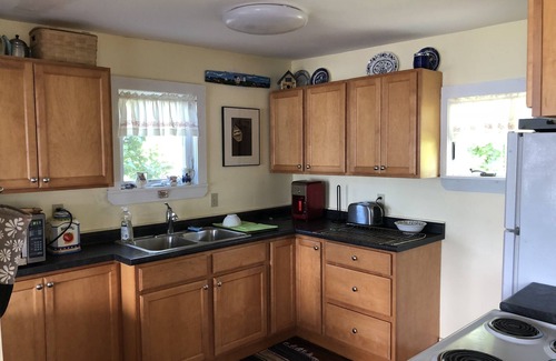 Pond Cove House | Evergreen cottage 5' from the water with private beach.