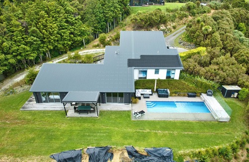 Mangawhai House | Exclusive home with uninterrupted views of the Hen & Chicks, set in Native Bush