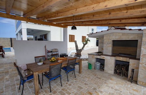 Rogoznica Villa | Exclusive villa for 8 people with heated pool & olive garden with a sea view