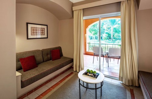 Makadi Bay Resort | Experience Serenity in 4 Family-Friendly Rooms with Pool & Stunning Garden View