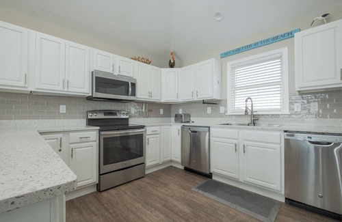 Ocean Sands House | Experience luxury at 1861 - Into the Mystic, a spacious 6-bedroom oceanfront home in Corolla, NC.
